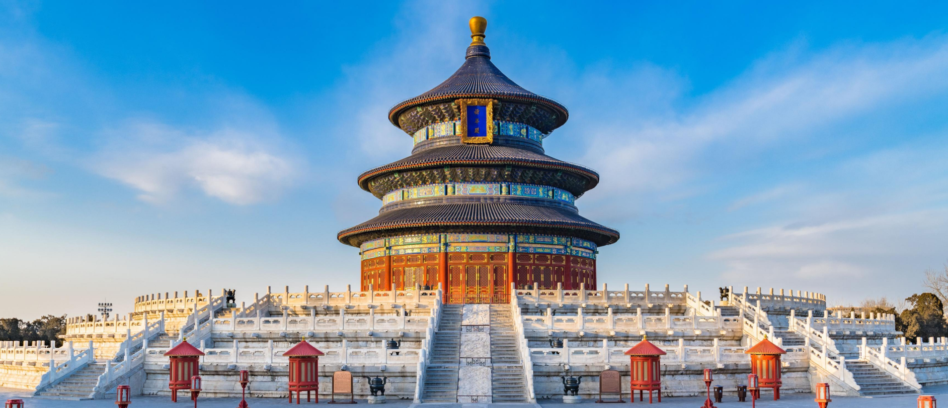 A Beijing watchtower reflected in the water at dusk